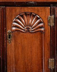 A Chippendale Figured and Shell-Carved Mahogany Slant Front Desk