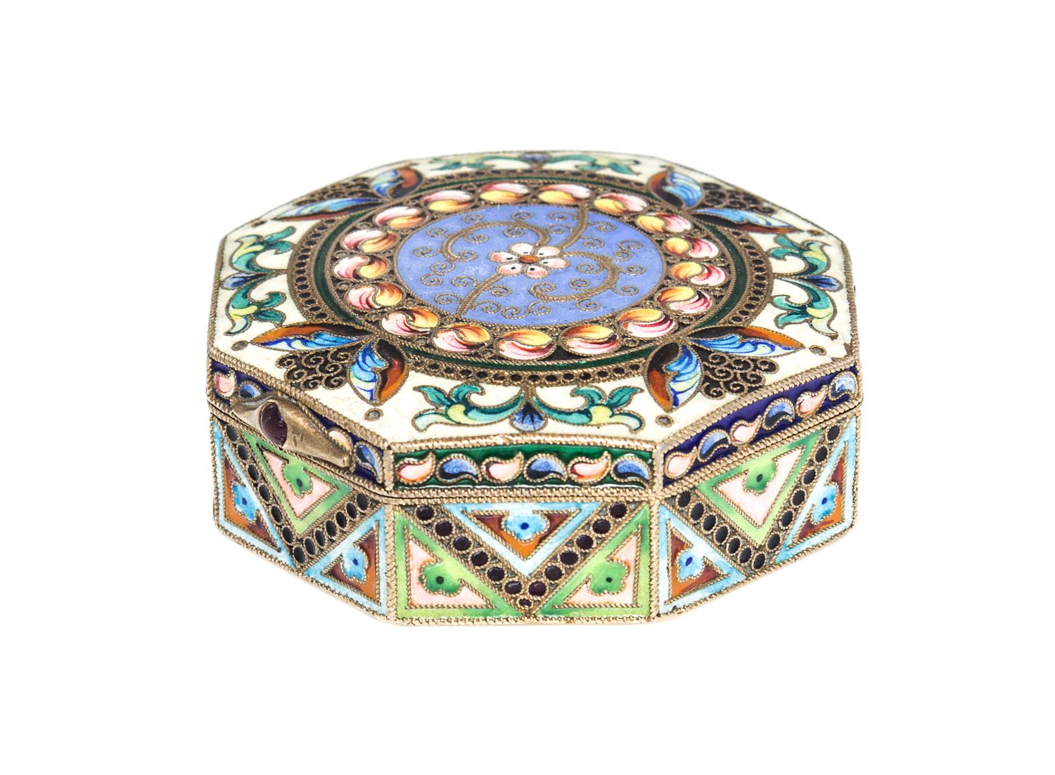 A Russian Enameled Gilt-Silver Pill Box, 11th Artel, Moscow, 1908-1926, of octagonal form with polychrome floral decoration.