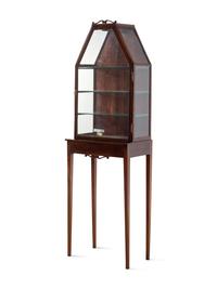 An English Mahogany Vitrine on Stand