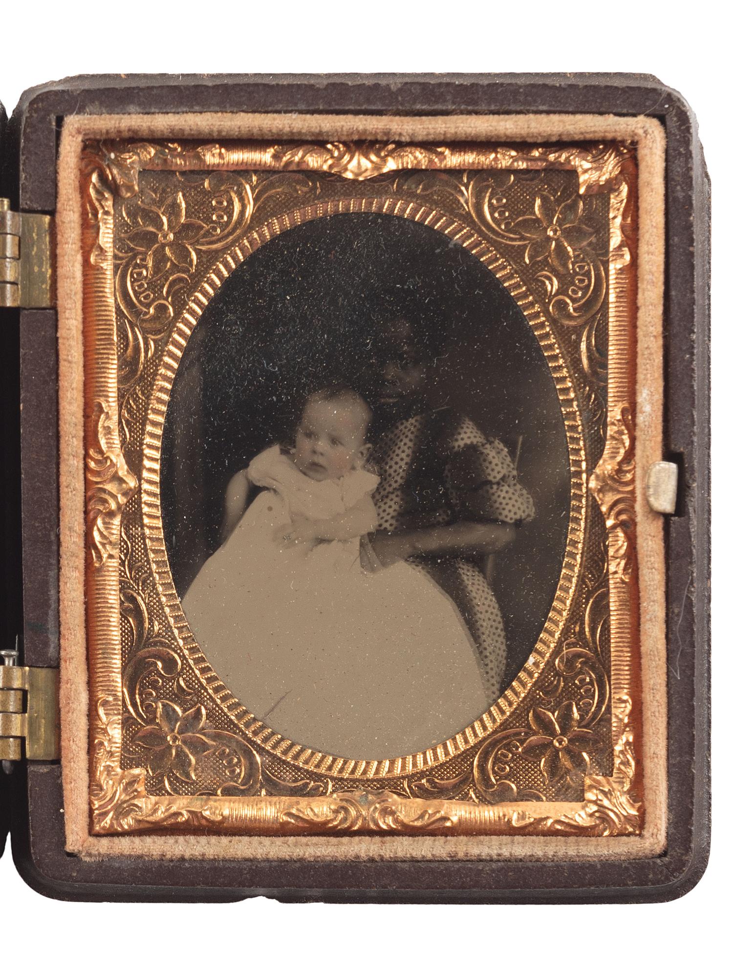 [EARLY PHOTOGRAPHY]. Ninth plate tintype portrait featuring a young African American girl holding a white baby.