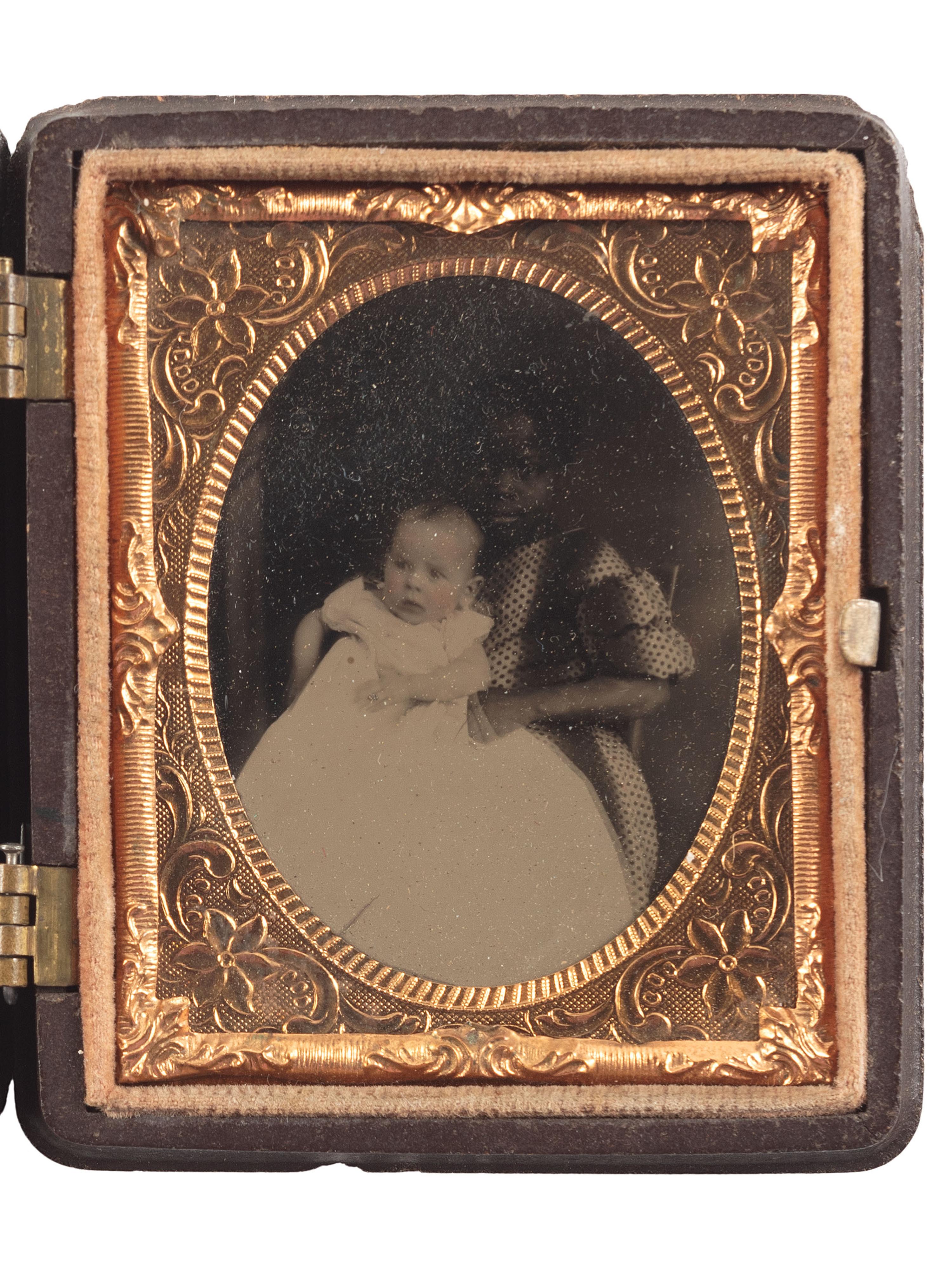 [EARLY PHOTOGRAPHY]. Ninth plate tintype portrait featuring a young African American girl holding a white baby.