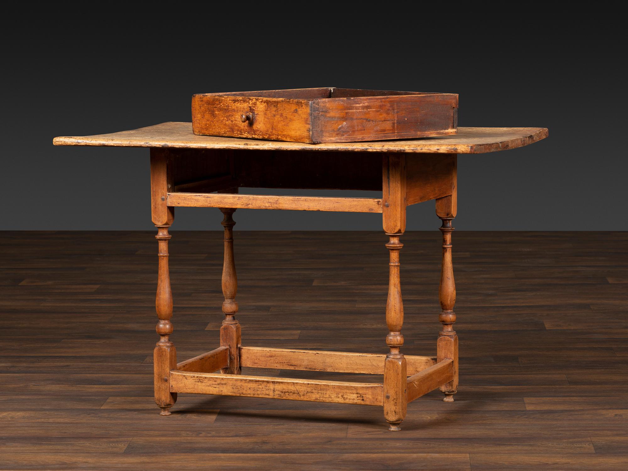 A William and Mary Pine and Maple Scrubbed Top Tavern Table