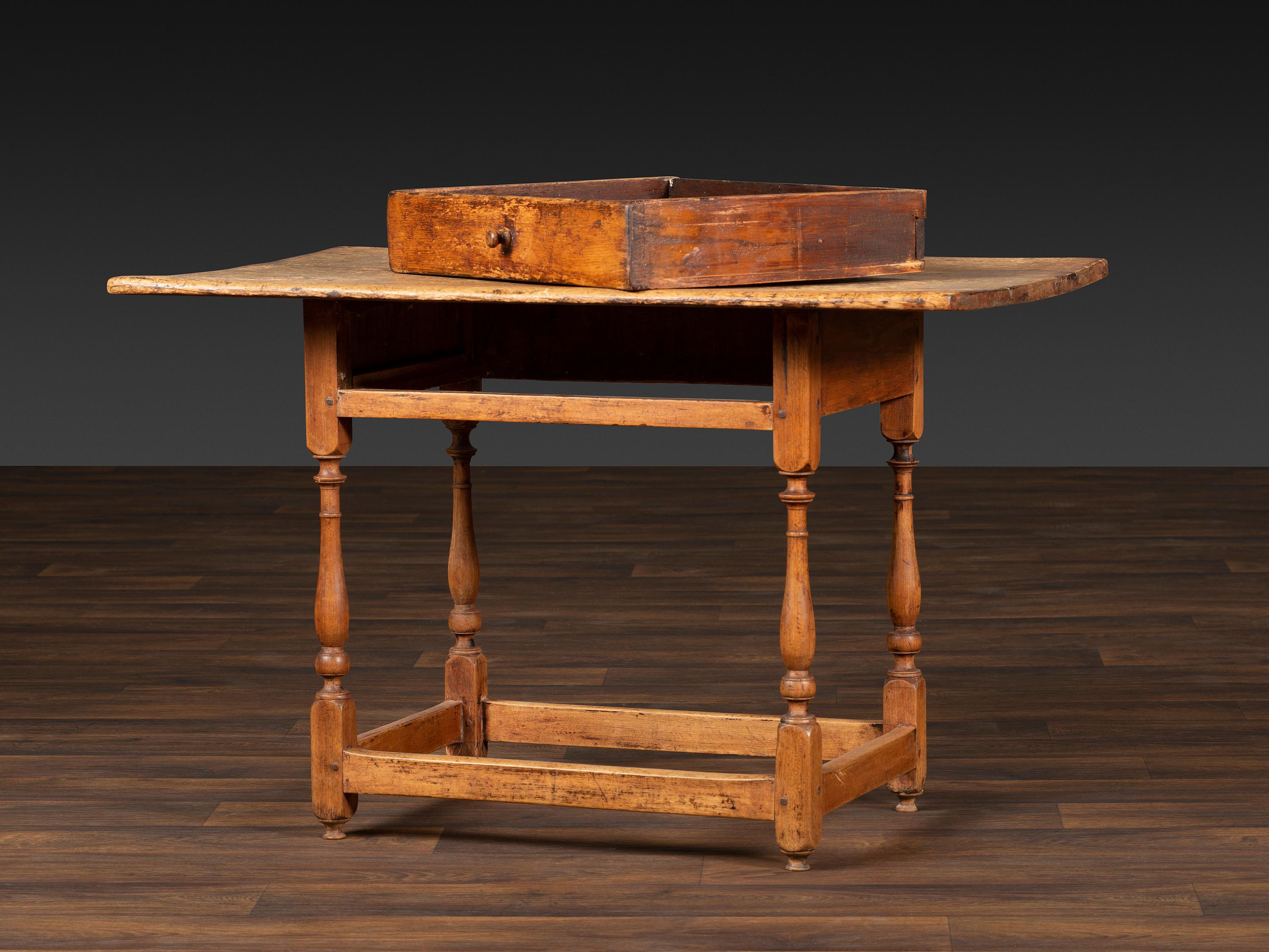 A William and Mary Pine and Maple Scrubbed Top Tavern Table