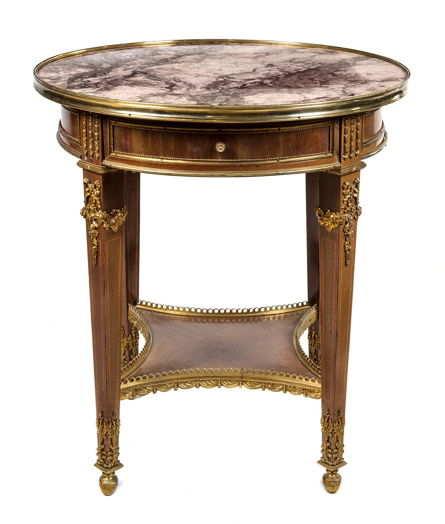 A Louis XVI Style Gilt Bronze Mounted Mahogany Gueridon Height 31 x diameter 27 1/2 inches. — 20TH CENTURY