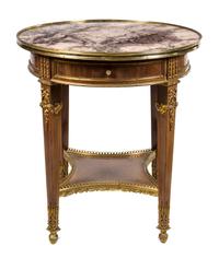 A Louis XVI Style Gilt Bronze Mounted Mahogany Gueridon Height 31 x diameter 27 1/2 inches. — 20TH CENTURY