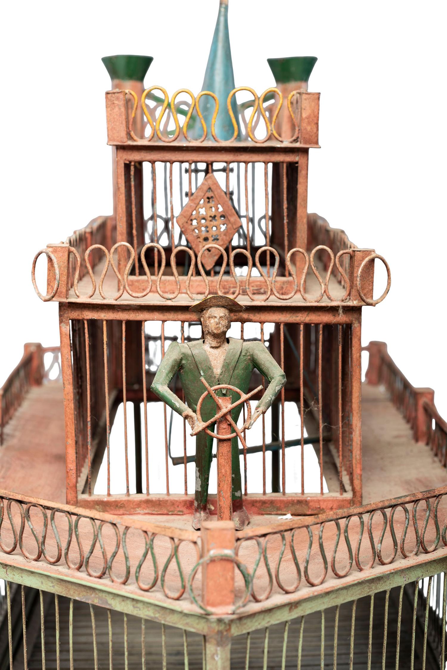 A Painted Sheet Metal and Wire Steamboat Form Birdcage