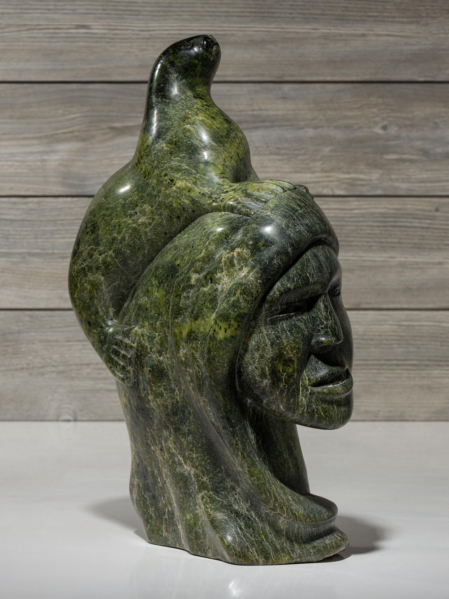 stone sculpture, woman and seal