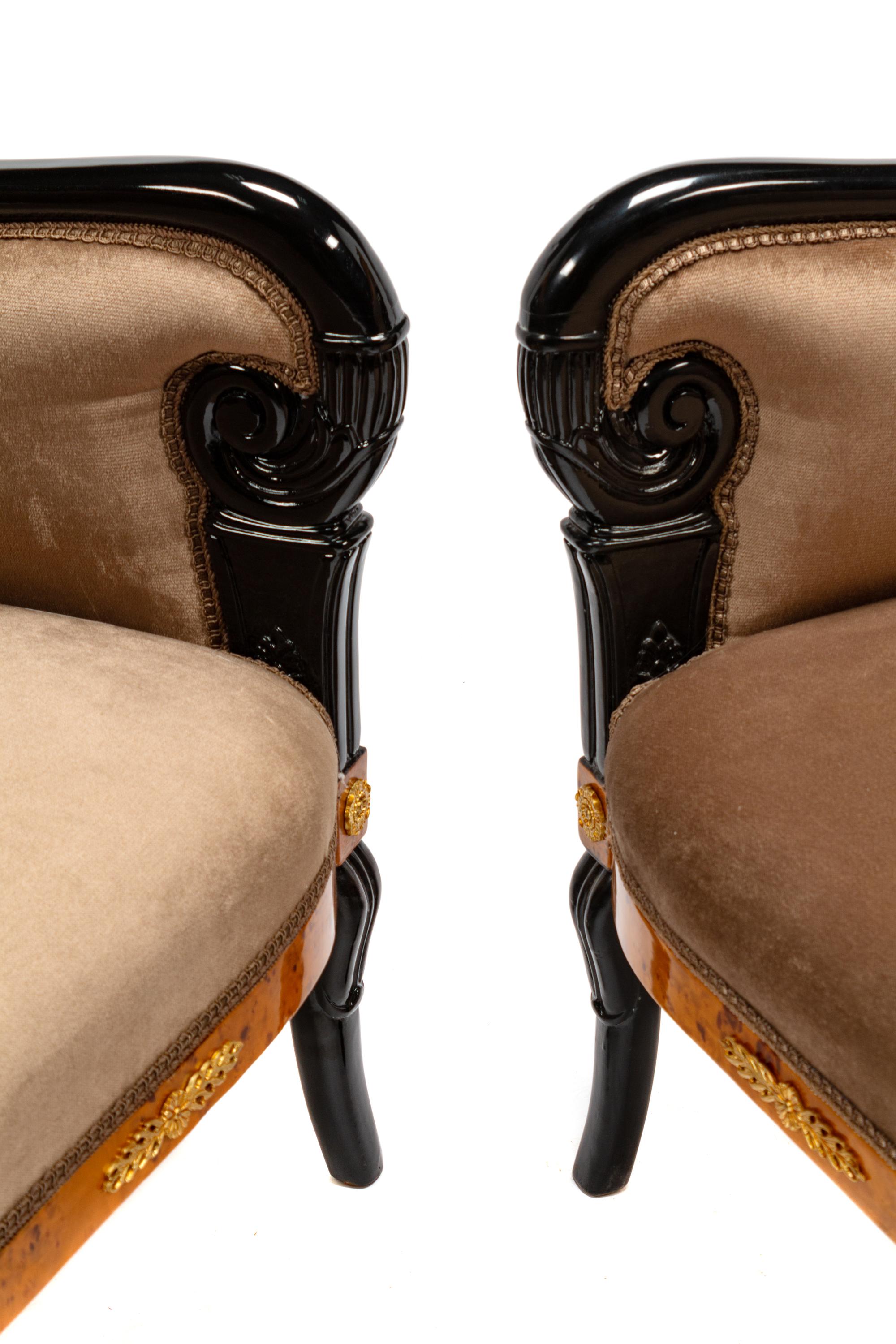 A Pair of Directoire Style Parcel Ebonized Burlwood Settees