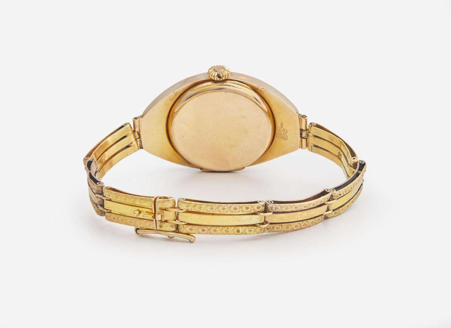 A Ladies 14K Yellow Gold Russian Invicta Watch with Diamonds