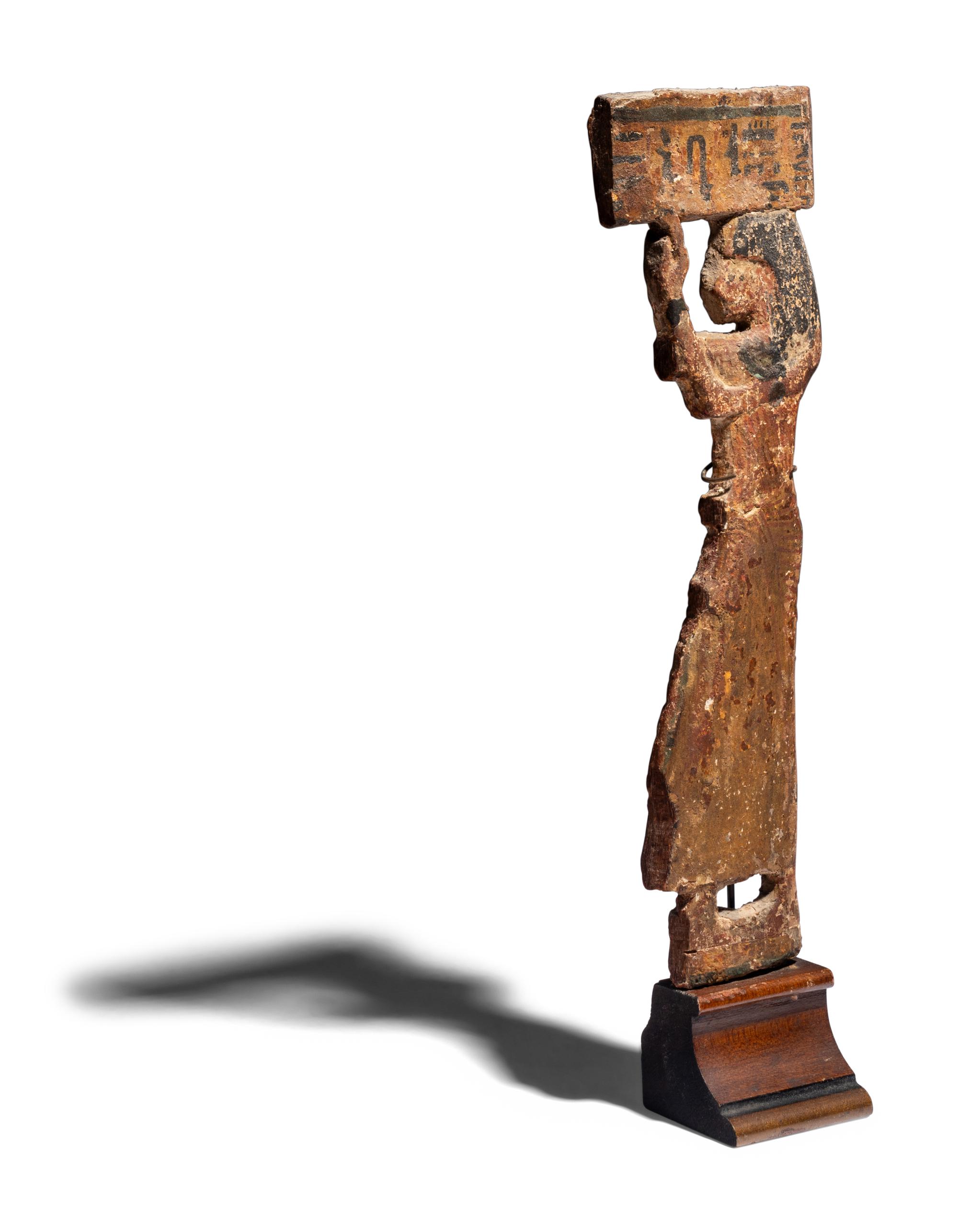 An Egyptian Wood Offering Bearer