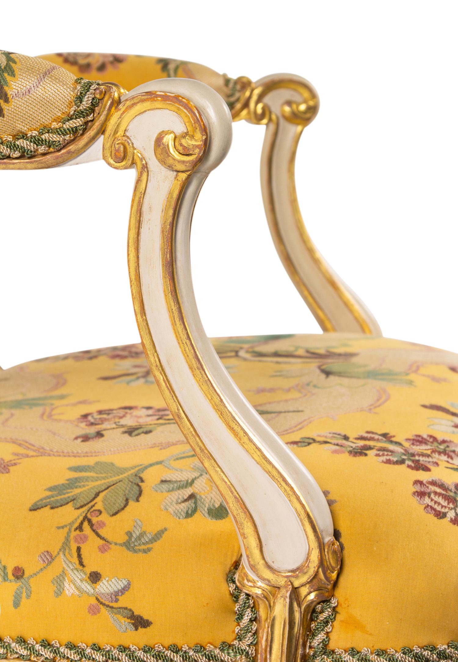 A George III White-Painted and Parcel-Gilt Open Armchair
