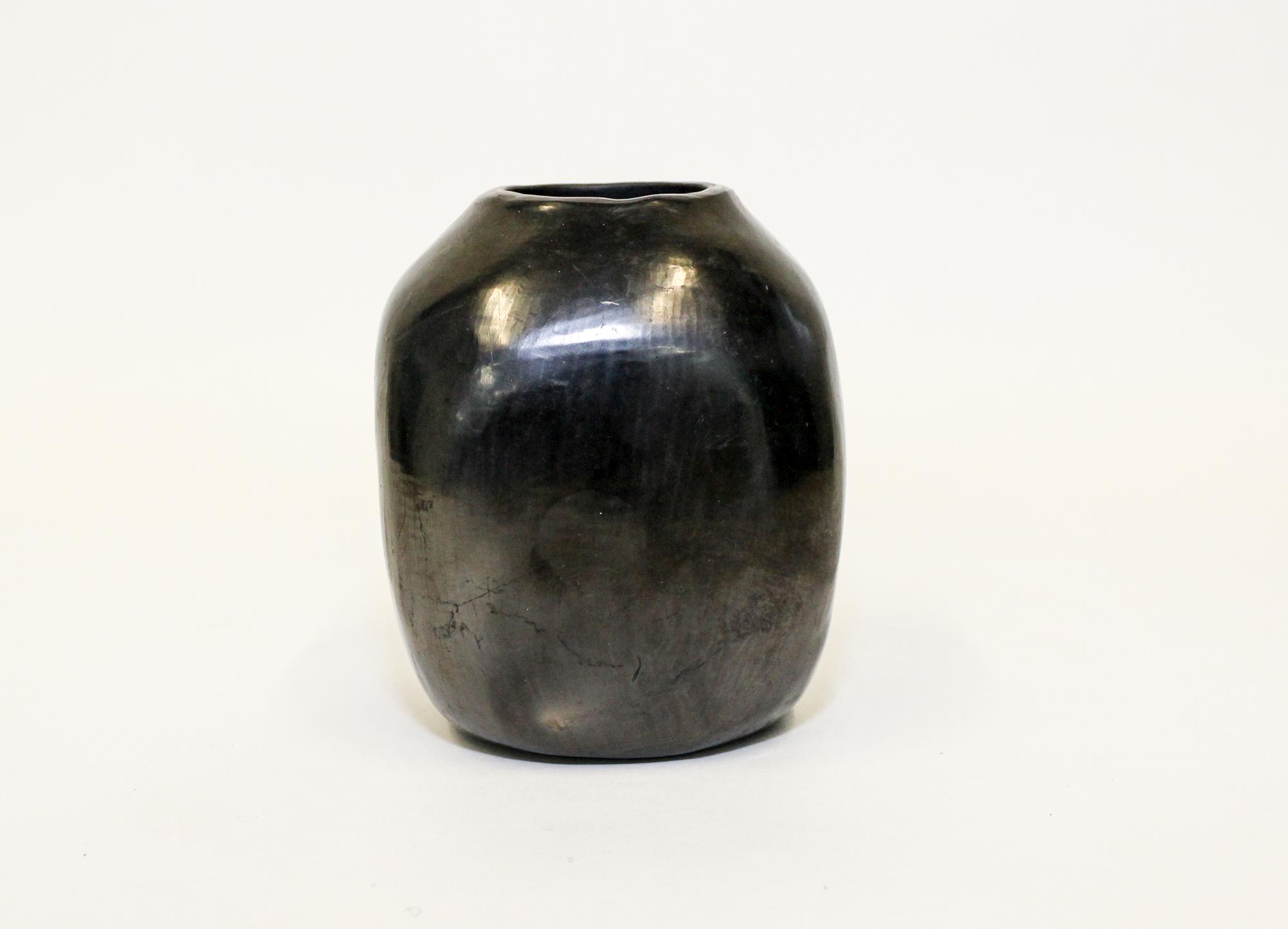A Blackware Pottery Vase, Dona Rosa, Oaxaco, Mexico Height 4 1/2 inches.
