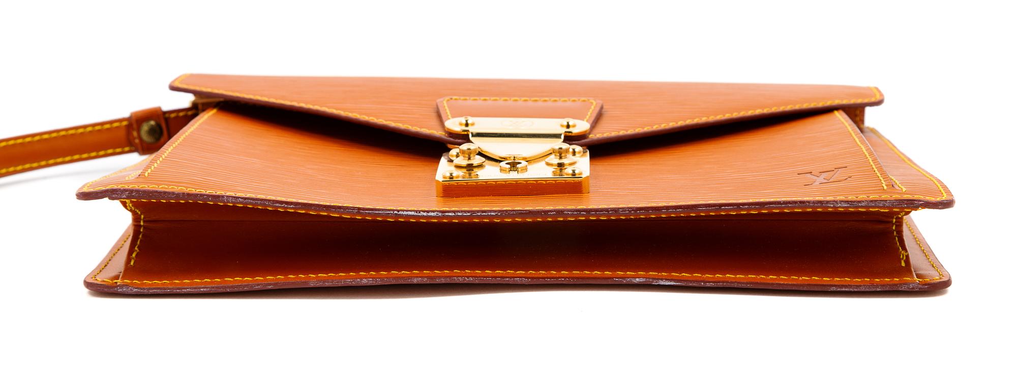 A Louis Vuitton Tan Epi Leather Sellier Dragonne Clutch, 6" H x 10.25" W x 1" D; Wristlet: 6" L.