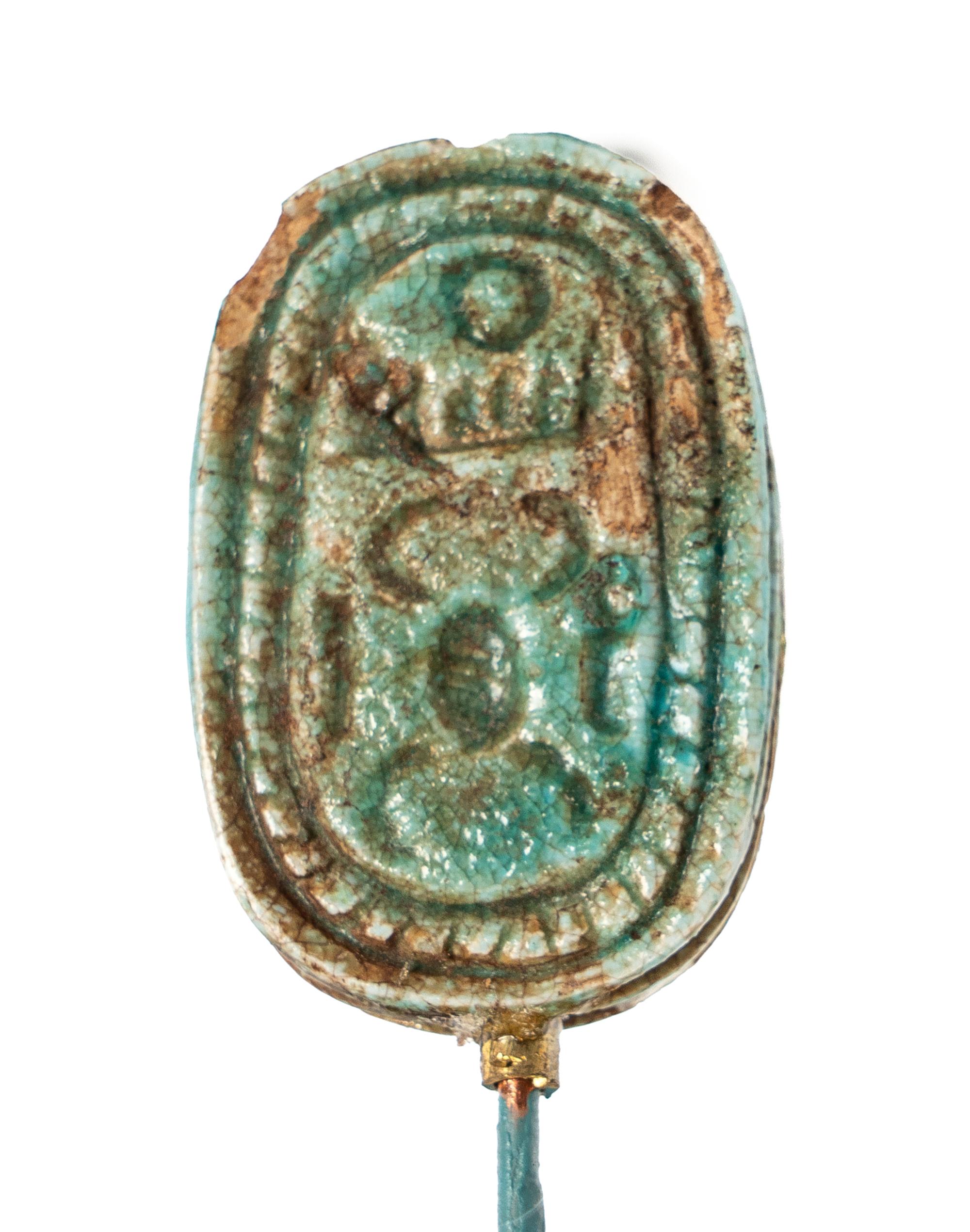 An Egyptian Faience Swivel Scarab