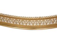 An Irish Pierced Brass Serpentine Fire Fender