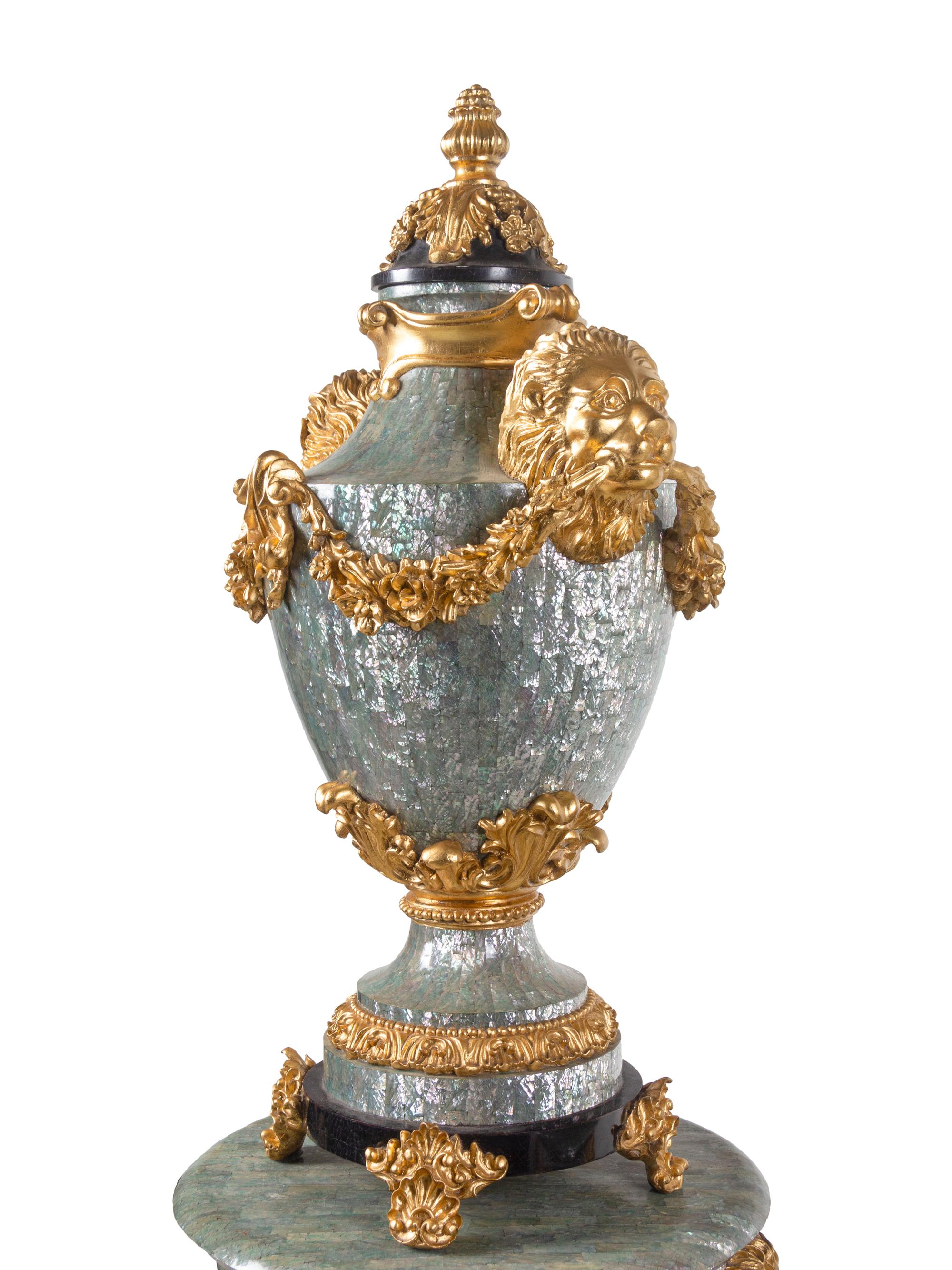 A Pair of Neoclassical Style Gilt Composite and Abalone Veneered Urns and Pedestals