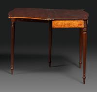 A Federal Birch Veneered and Inlaid Mahogany Serpentine-Top Games Table
