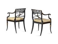 A Pair of Regency Ebonized and Parcel-Gilt Armchairs