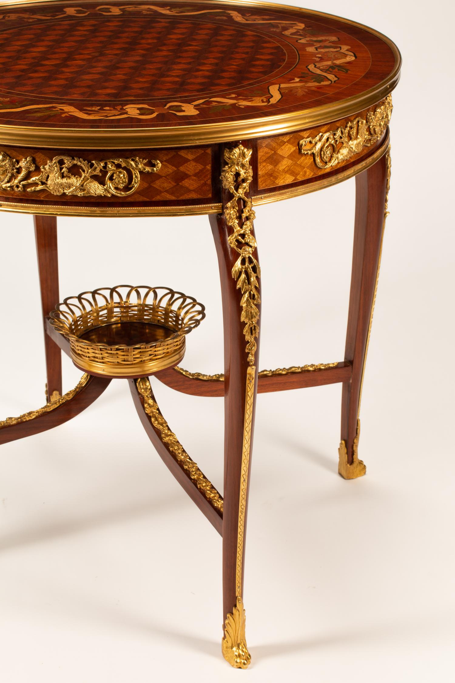 A Louis XV Style Gilt Bronze Mounted Marquetry Table