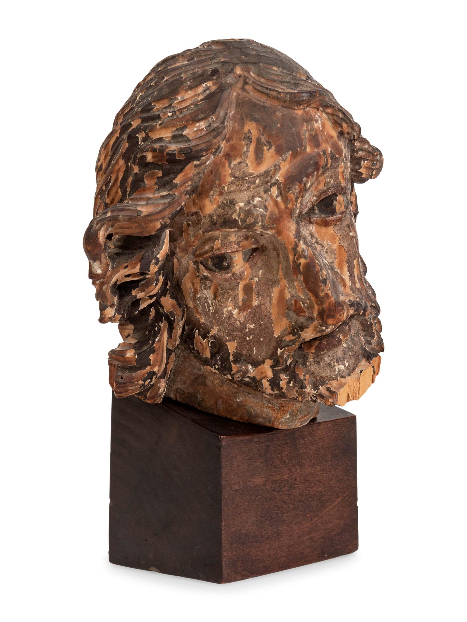 A Continental Carved and Polychromed Bust of a Saint