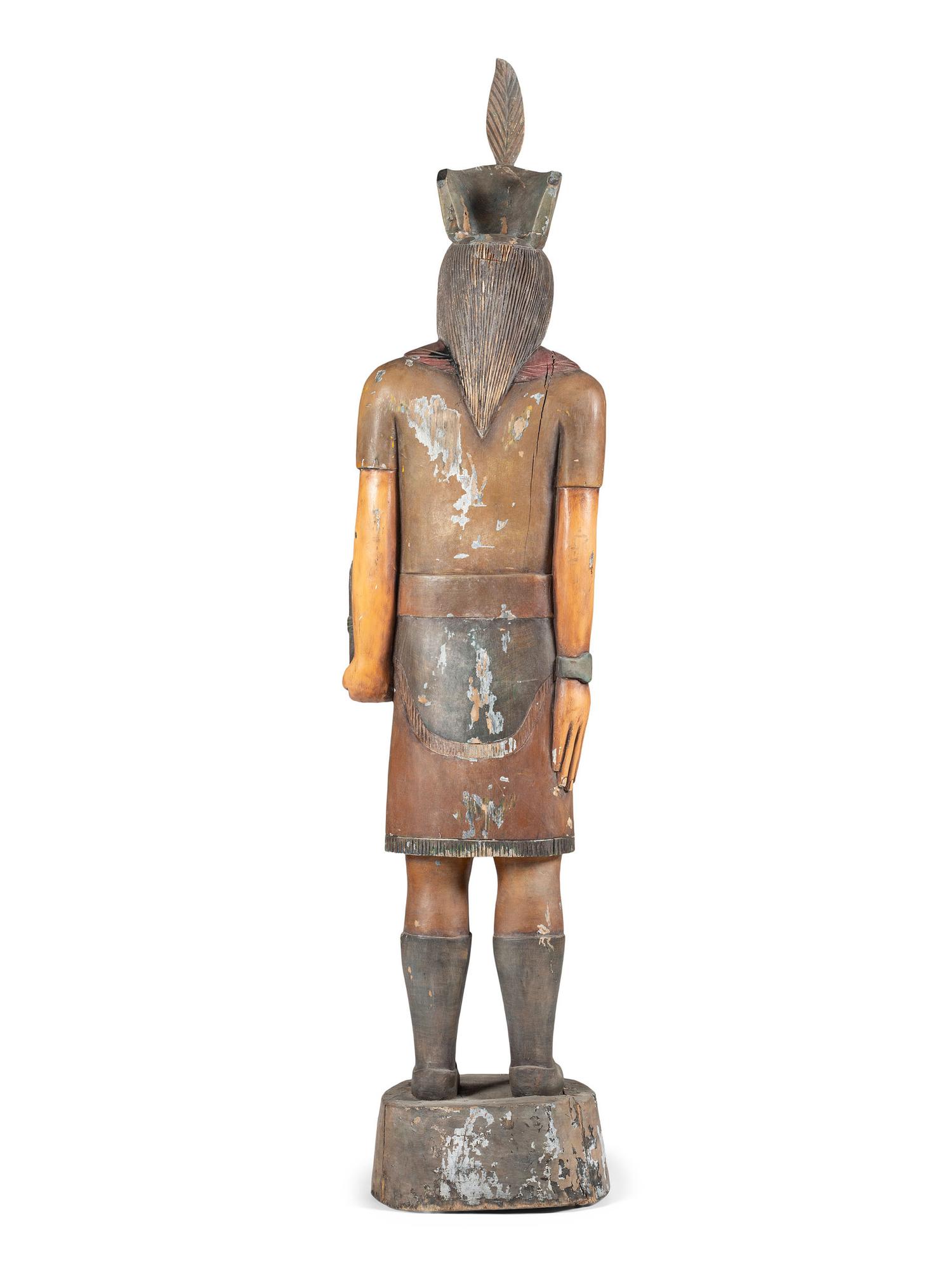 A Carved and Painted Wood Tobacco Trade Figure of a Native American