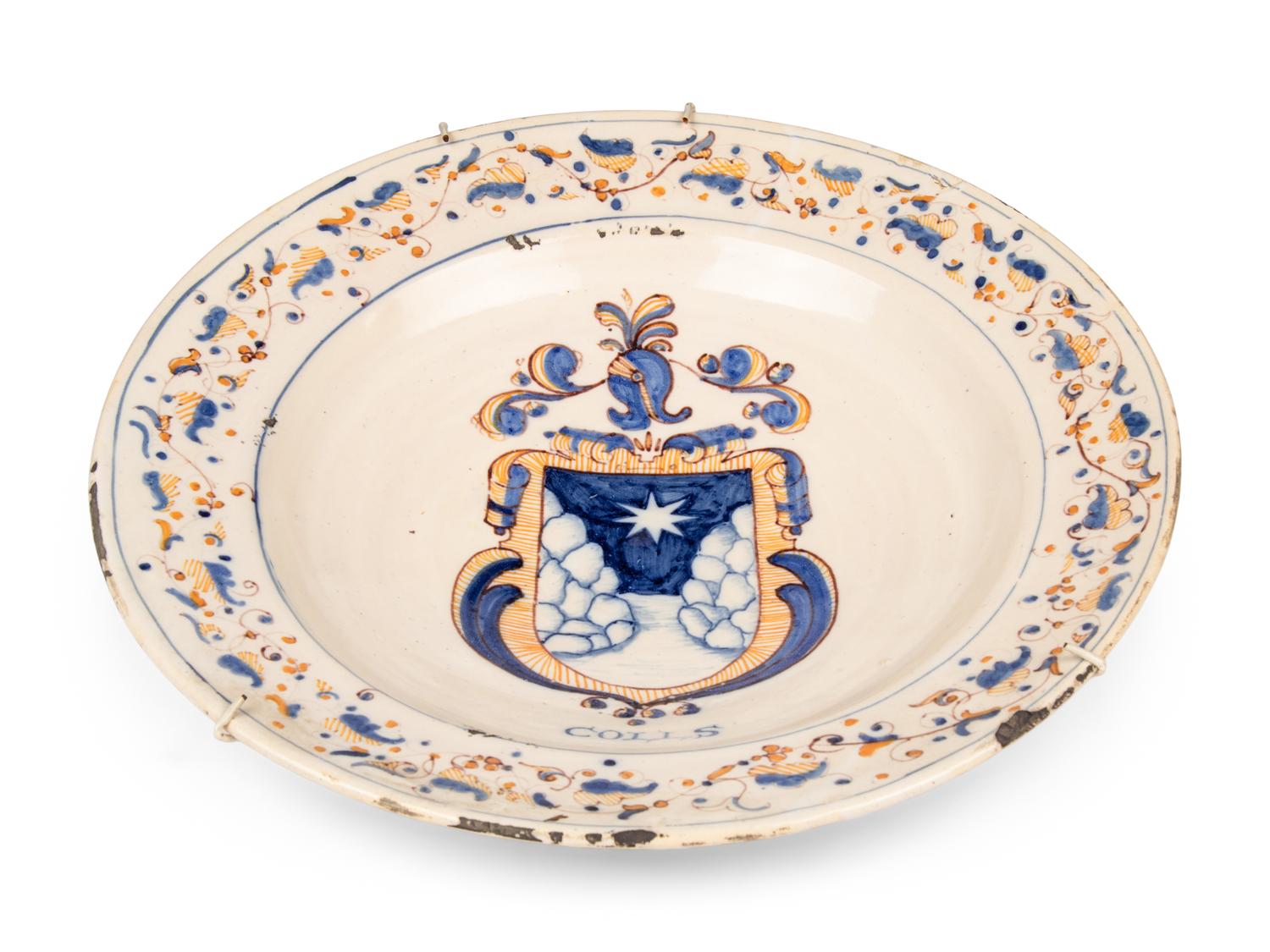 A Dutch Glazed Earthenware Armorial Charger