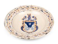 A Dutch Glazed Earthenware Armorial Charger