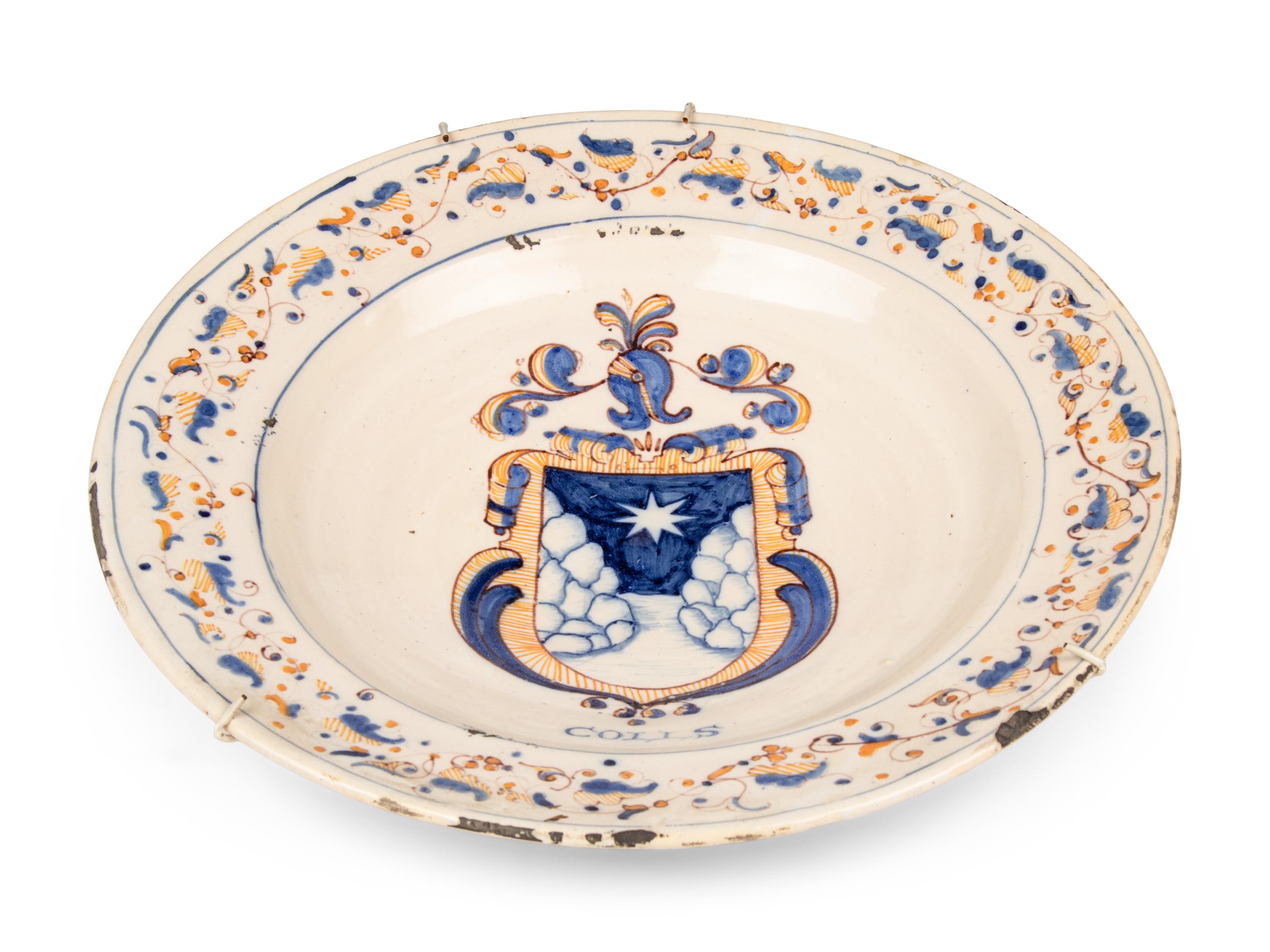A Dutch Glazed Earthenware Armorial Charger