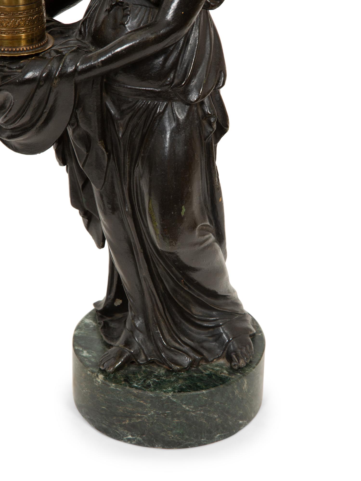 A Pair of Figural Hurricane Candlesticks on Verde Antico Marble Bases