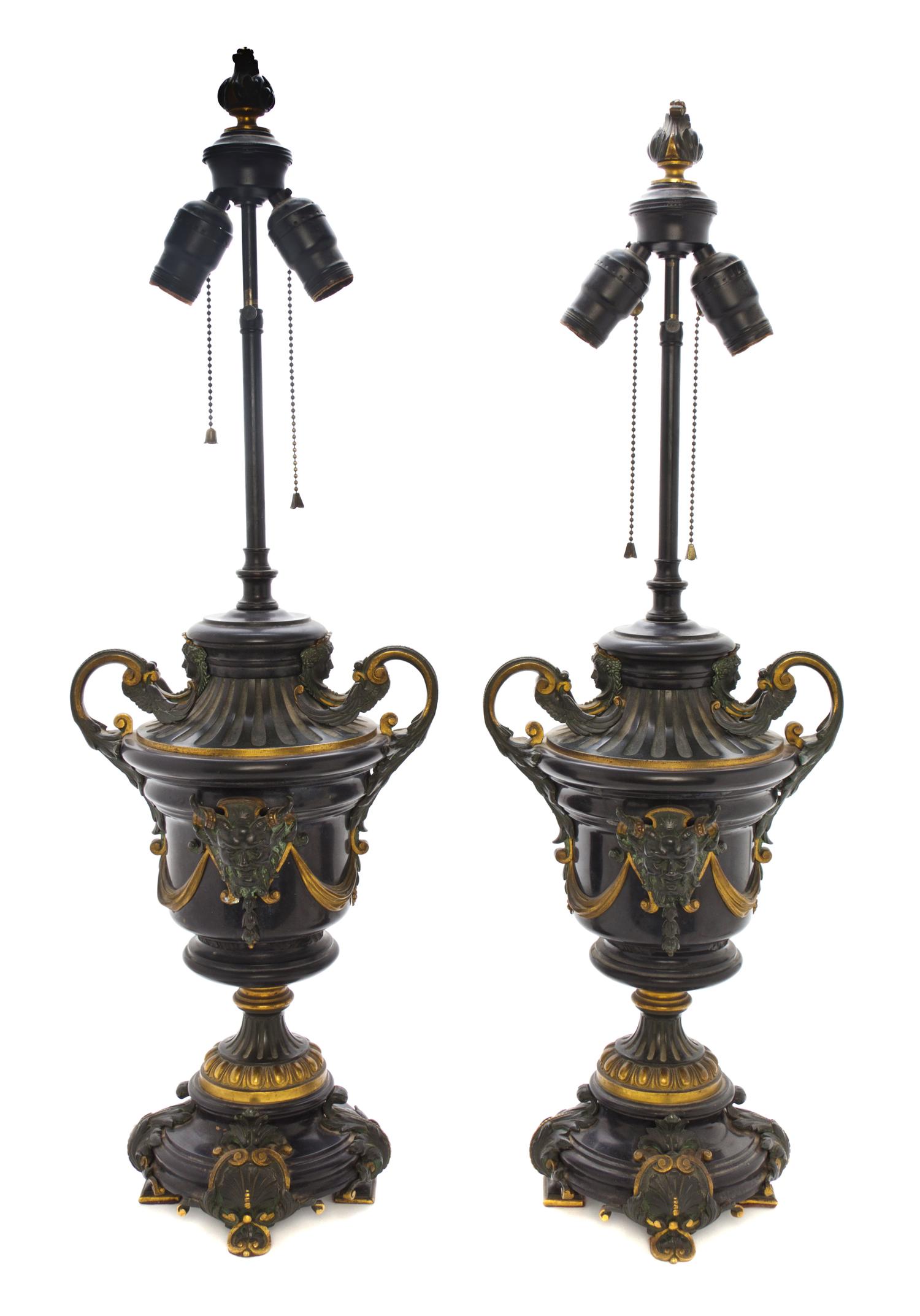 A Pair of Neoclassical Bronze Mounted Marble Urns, Height 18 inches.