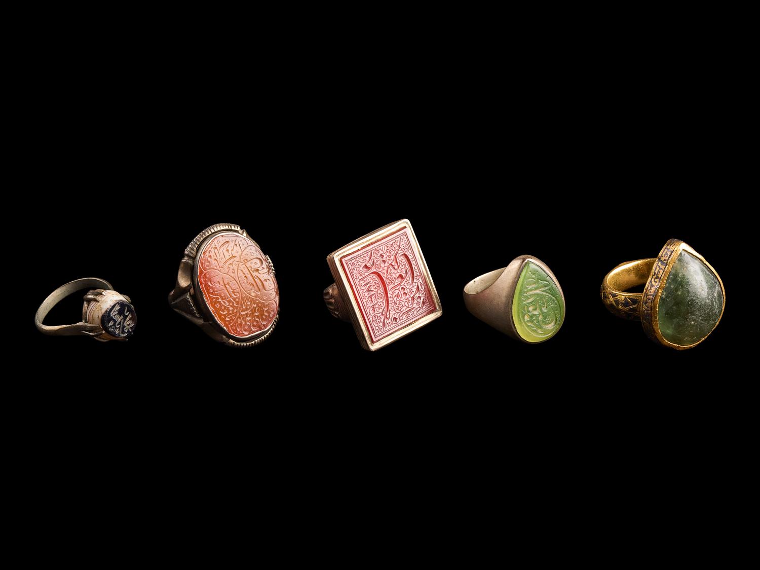 A Group of Five Islamic Stone and Metal Finger Rings