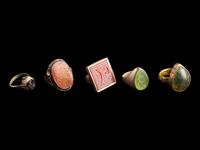 A Group of Five Islamic Stone and Metal Finger Rings