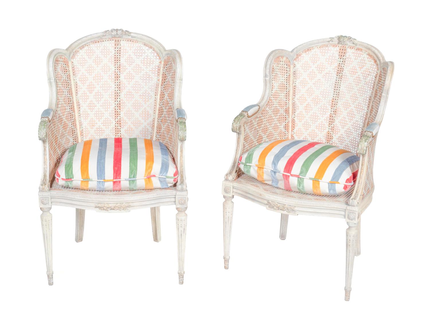 A Pair of Louis XVI Style White-Painted and Caned Bergeres a Orielles