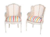 A Pair of Louis XVI Style White-Painted and Caned Bergeres a Orielles