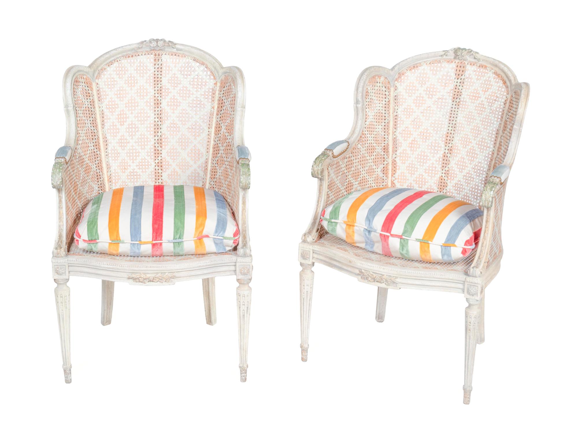 A Pair of Louis XVI Style White-Painted and Caned Bergeres a Orielles