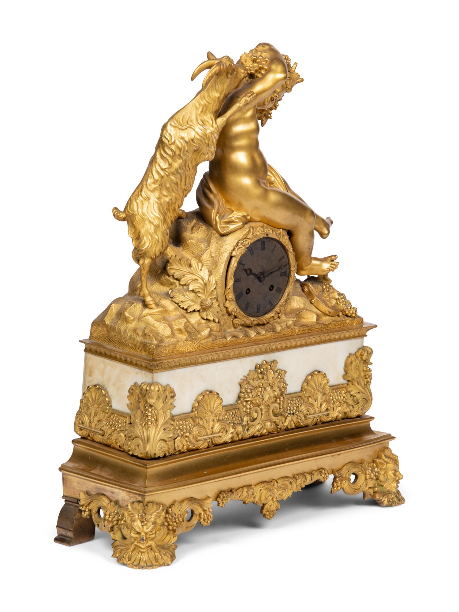 A Louis Philippe Gilt Bronze and White Marble Mantel Clock