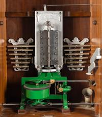A 24-Inch Lochmann's Original Disc Music Box with Tubular Bells and Base Cabinet