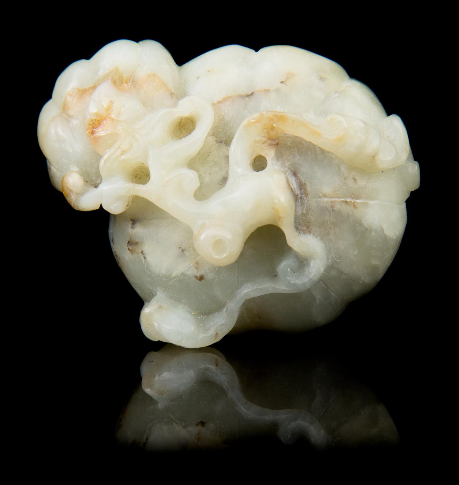 A Carved Jade Toggle Length 2 1/8 inches.