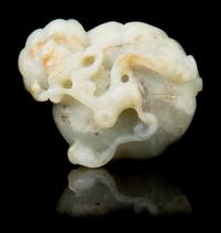 A Carved Jade Toggle Length 2 1/8 inches.