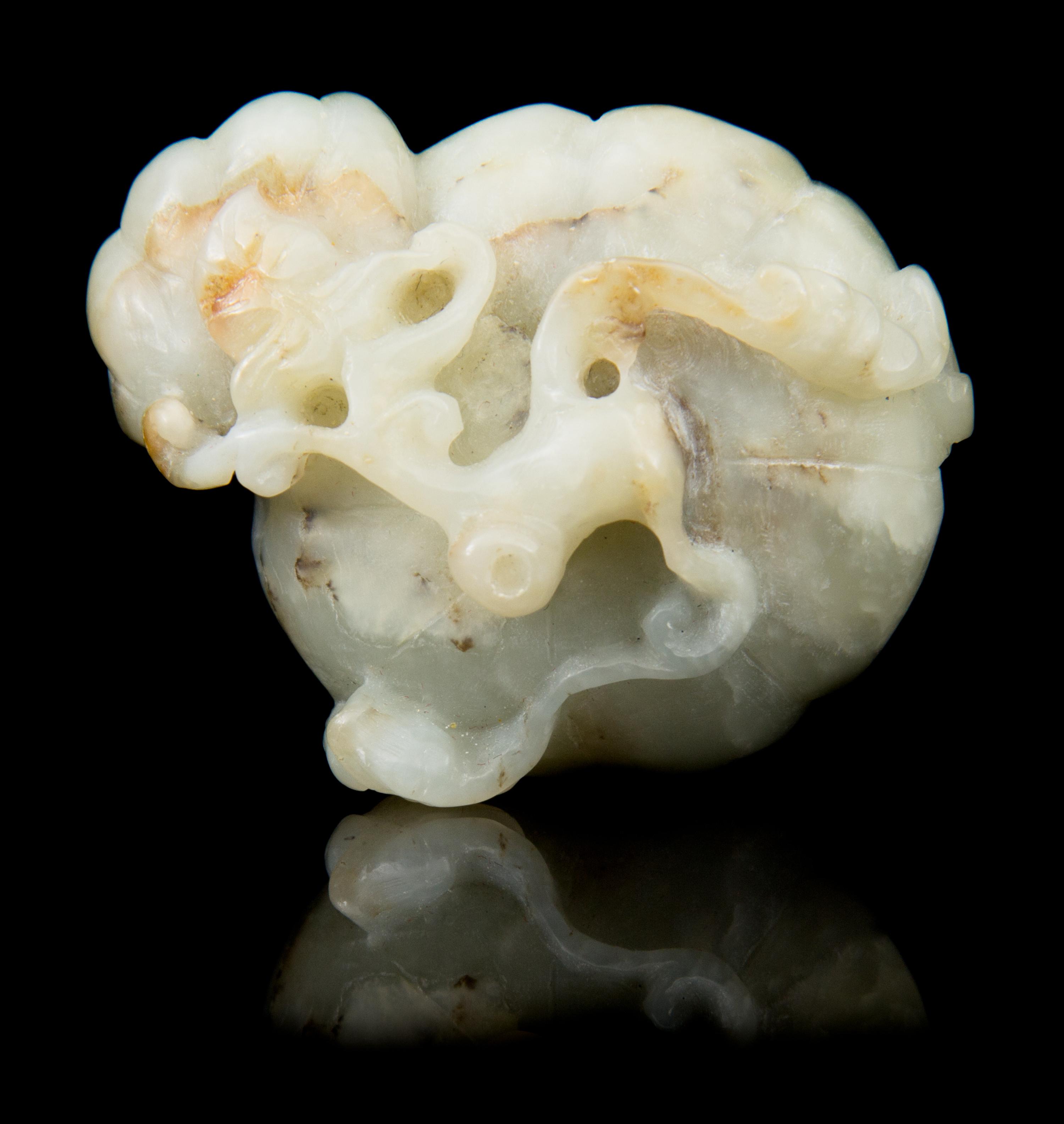 A Carved Jade Toggle Length 2 1/8 inches.