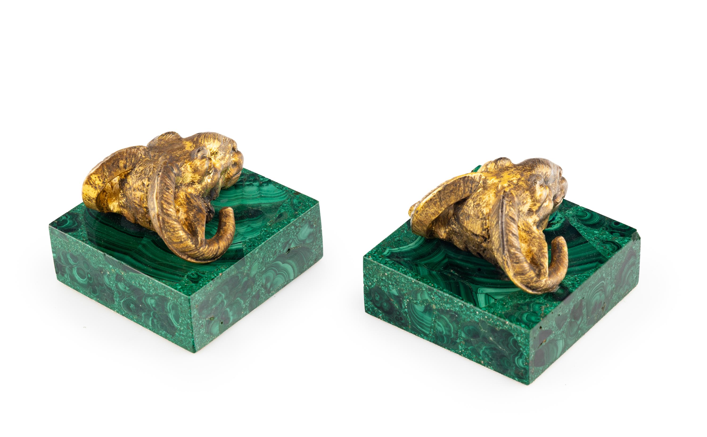 A Pair of Gilt Bronze and Malachite Ram's Head Table Ornaments