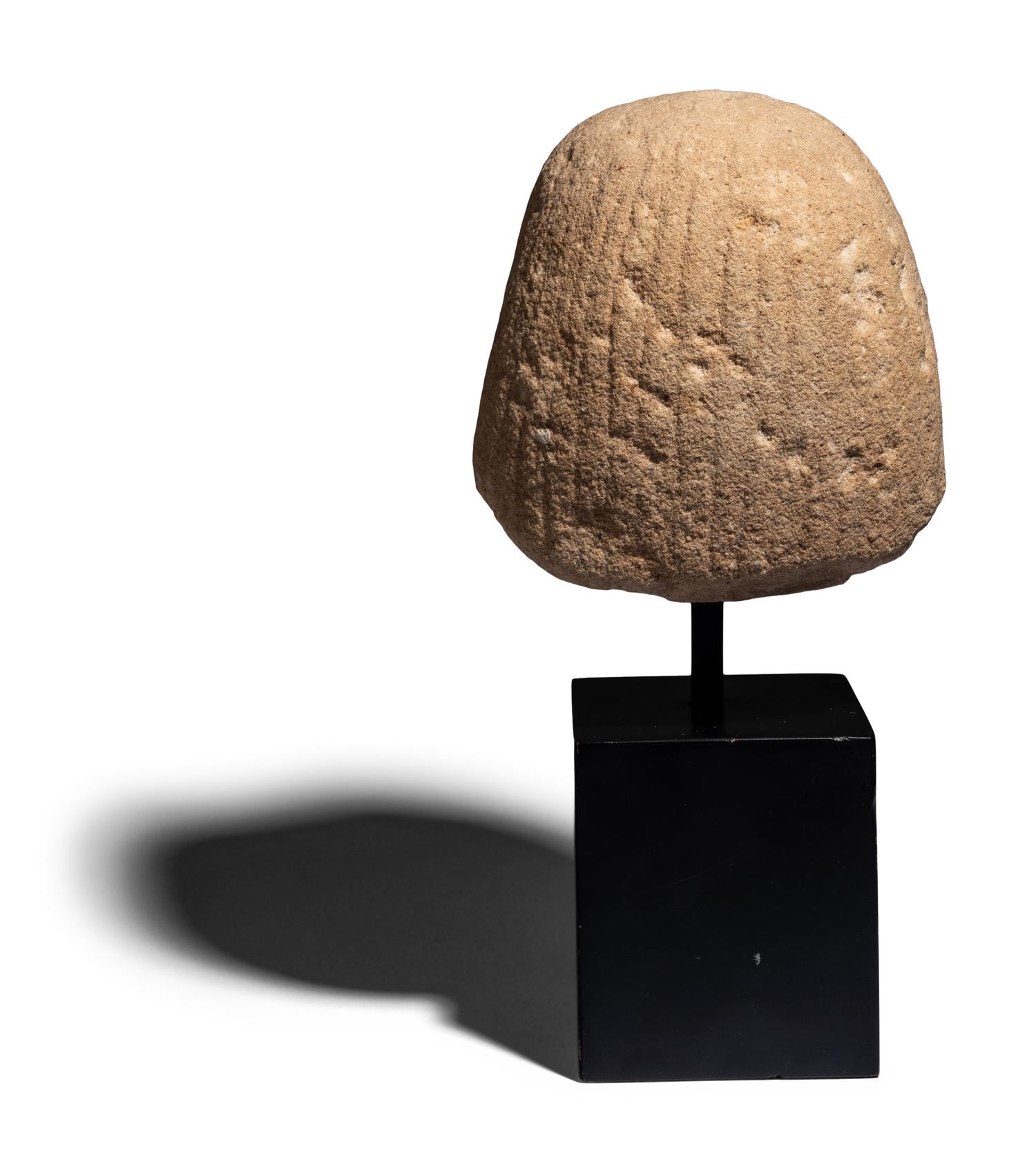 An Egyptian Painted Limestone Portrait Head of an Official