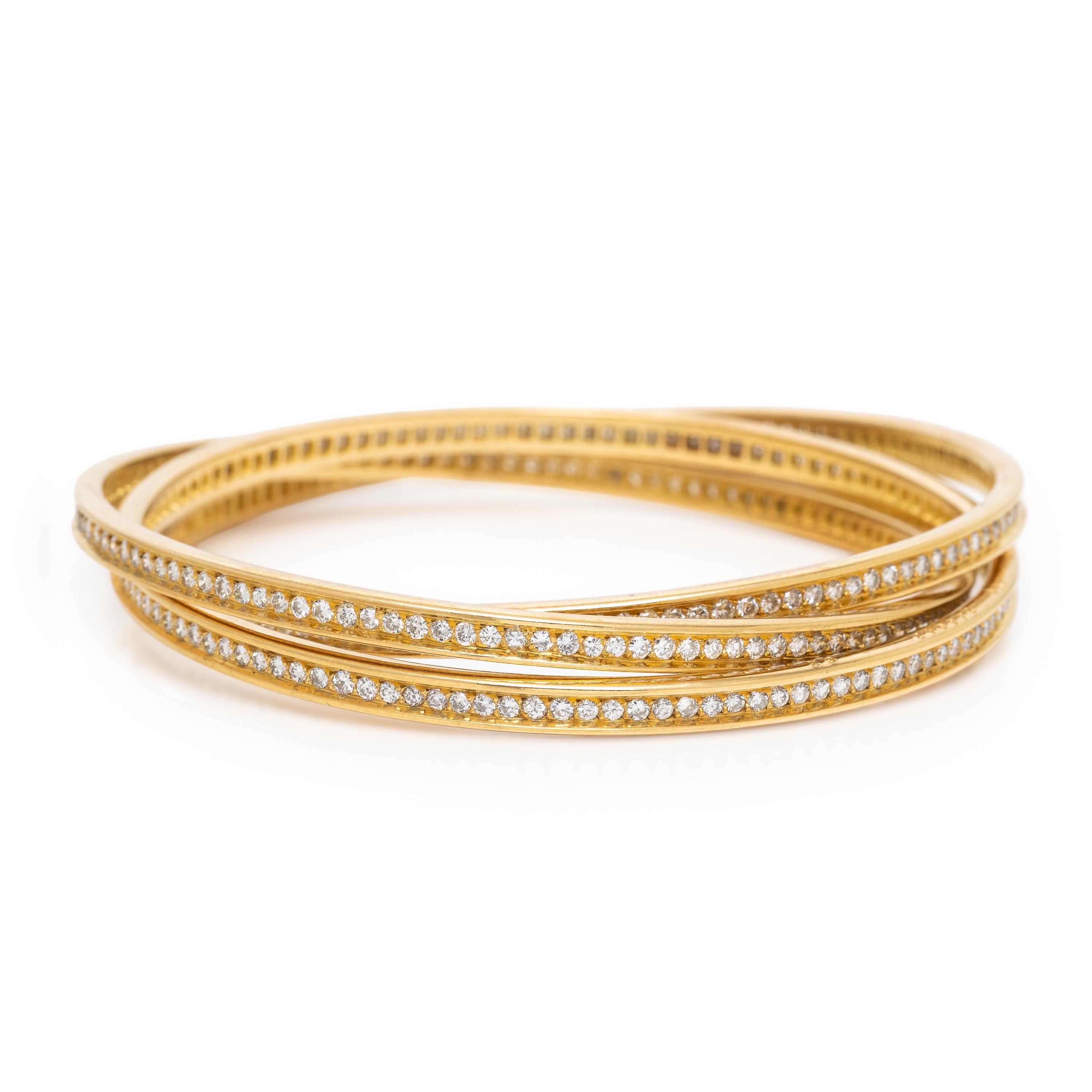 CARTIER, YELLOW GOLD AND DIAMOND 'TRINITY' BANGLE BRACELET
