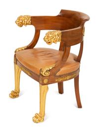 An Empire Gilt Bronze Mounted Mahogany and Parcel Gilt Fauteuil de Bureau