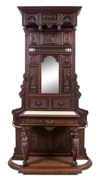 A Renaissance Revival Carved Oak Hall Tree Height 106 x width 54 1/2 x depth 17 inches. — 19TH CENTURY