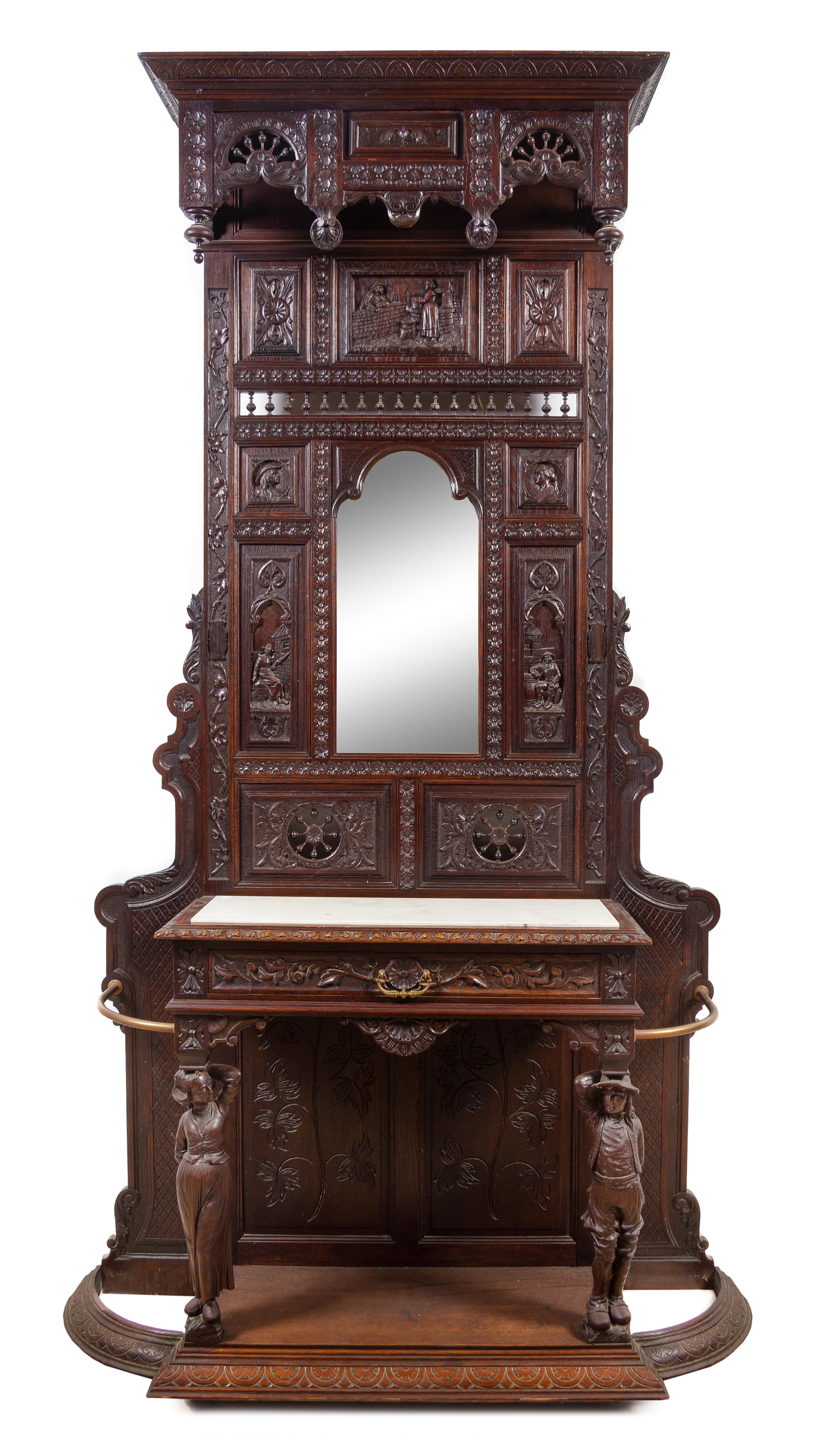 A Renaissance Revival Carved Oak Hall Tree Height 106 x width 54 1/2 x depth 17 inches. — 19TH CENTURY