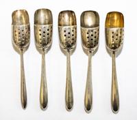 A Collection of American Silver and Silver-Plate Salt Sifter Spoons, various makers, each having a shovel bowl with a perforated panel