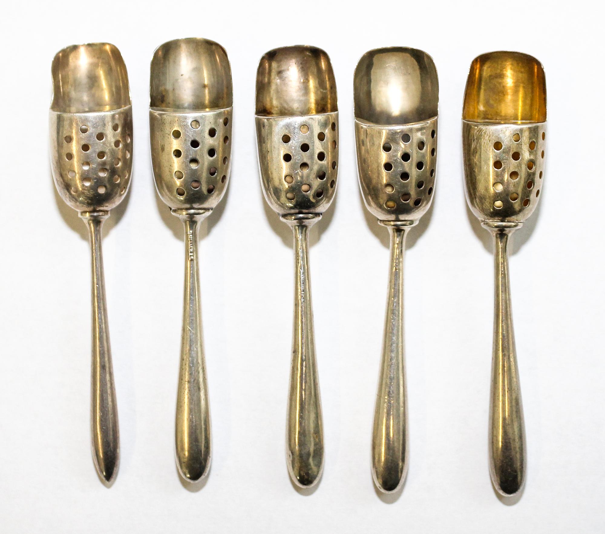 A Collection of American Silver and Silver-Plate Salt Sifter Spoons, various makers, each having a shovel bowl with a perforated panel