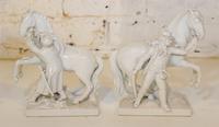 A Pair of KPM Blanc de Chine Equestrian Groups. Height 8 inches.