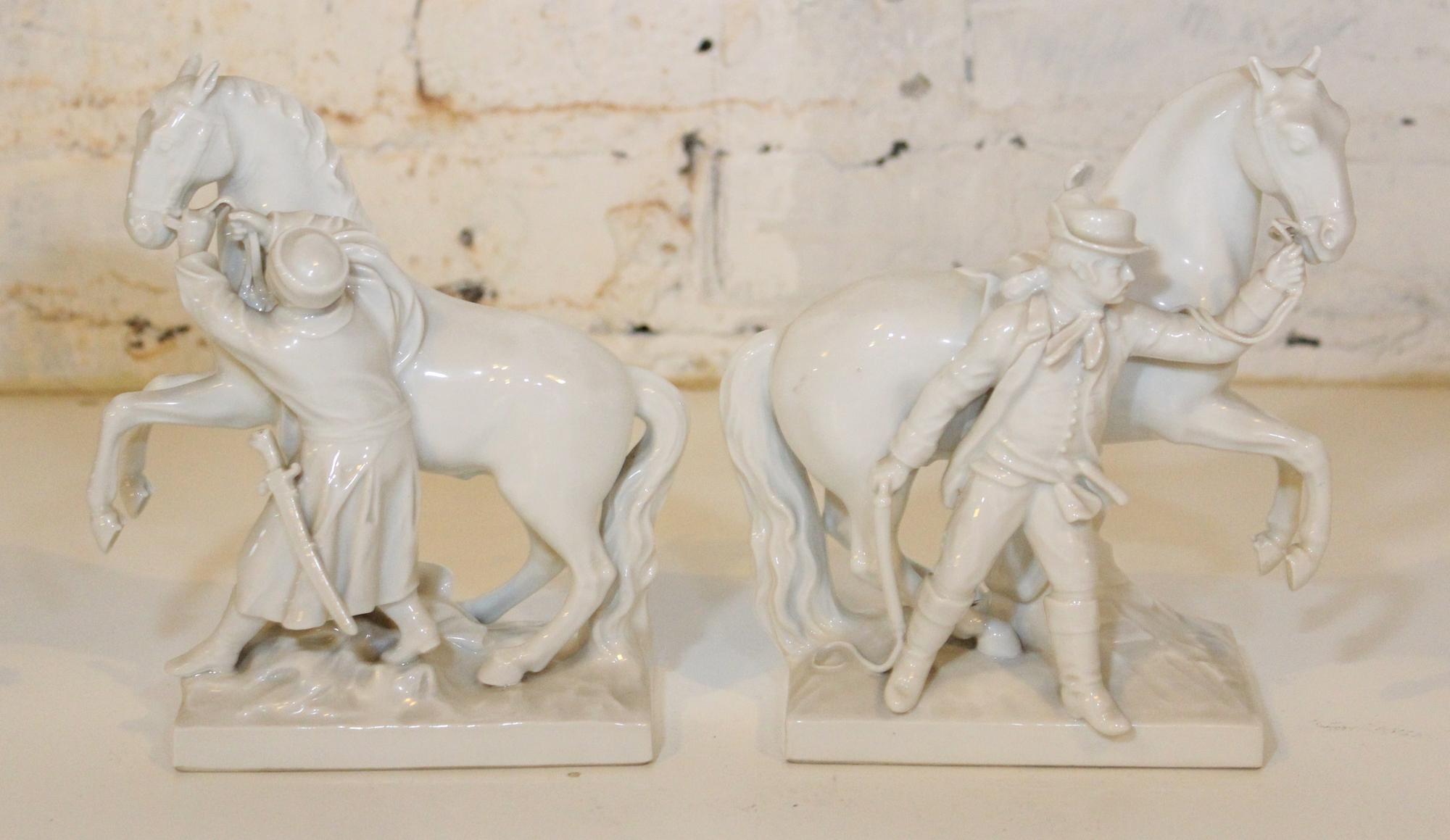 A Pair of KPM Blanc de Chine Equestrian Groups. Height 8 inches.